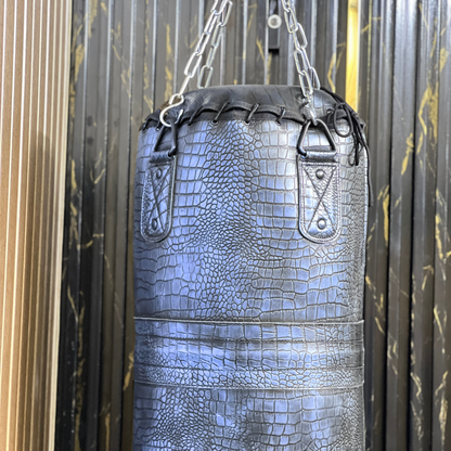 hd pictures of leather punching bag of purple color in crocodile pattern