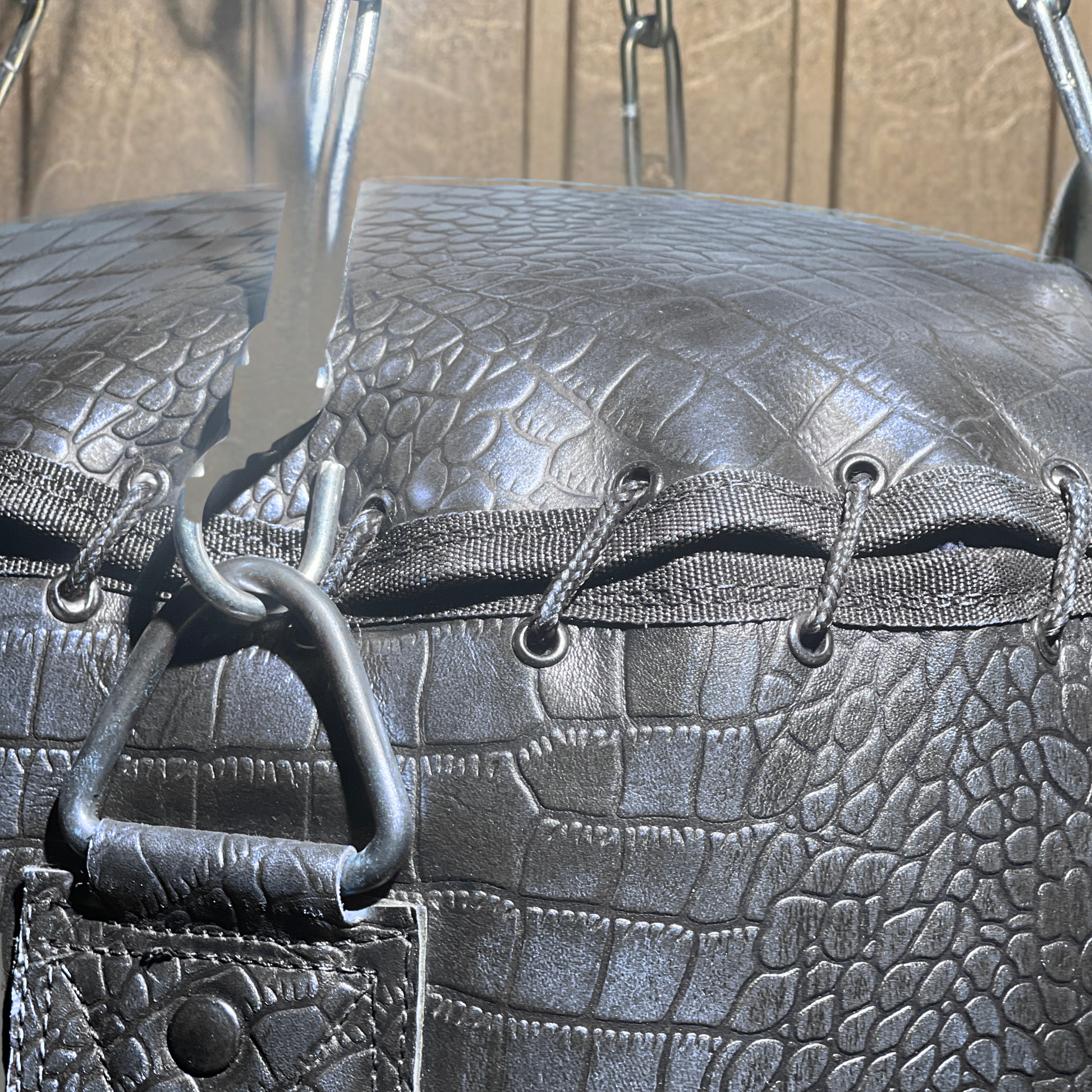 close up string closure of leather punching bag of purple color