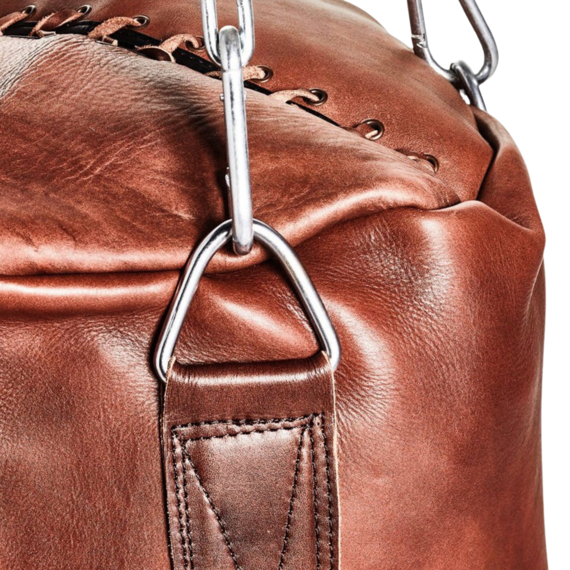 Close-up detail of the Blood-Fang Pro Punching Bag shows the durable heavy-duty cowhide texture and meticulous handmade heavy bag construction with reinforced stitching. This genuine leather heavy bag is essential Boxing Training Equipment and top-tier Gym Workout Gear. The vintage leather punching bag finish confirms the premium quality of the unfilled punching bag for serious MMA Kickboxing Bag sessions, secured by a professional steel chain
