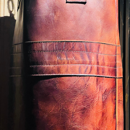 close up image of leather punching bag made up of cowhide showing leather strip connecting two panels of punching bag. giving extra strength to punching bag. boxing training equipment, mma training equipment, high quality finish, stitching, luxury product